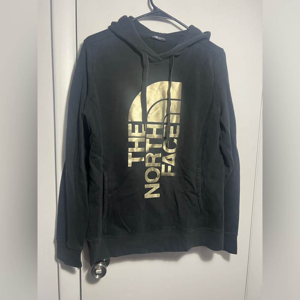The North Face Black Hoodie with Gold Graphic